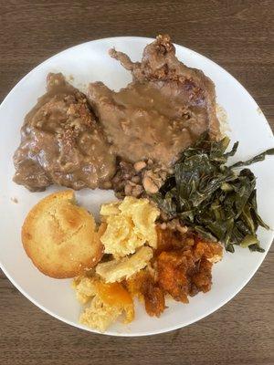 Smothered fried chicken, pork chop, Mac n cheese, yams and collard greens