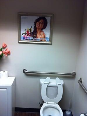 Unisex restroom is clean and nice, but the picture of a women on the wall is strange if not creepy; she's watching you pee lol