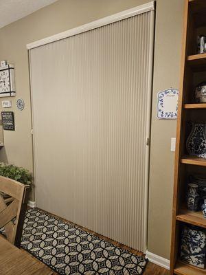 This beautiful vertical sliding blinds replaced our old one.