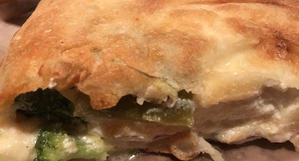 Veggie calzone- broccoli, tomatoes, green peppers, onions, mushrooms, mozzarella, and LOTS of ricotta. Yum!