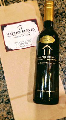 Rafter Eleven 's ~ Tuscan Herb Olive Oil.  Produced by local Ranch. The logo is their cattle brand.