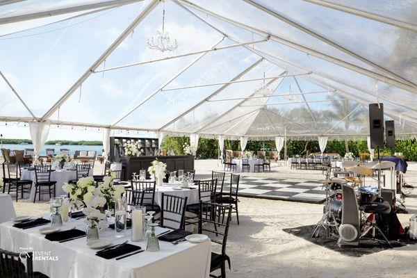 Clear Top Tent + Checkered Dance Floor + Black Chiavari Chairs + Decorated Tables + Beach Front Wedding