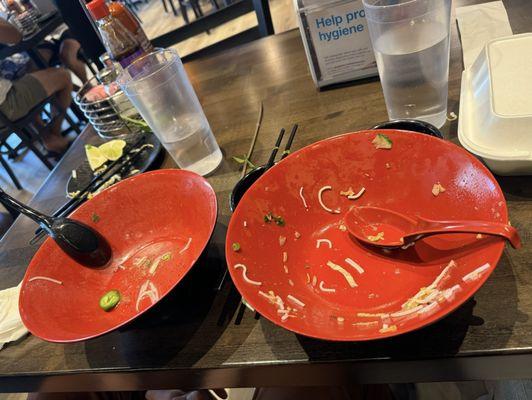 Sorry empty dishes from a delicious food. Pho and a bowl.