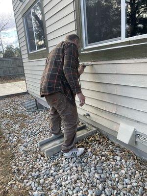 Painting the trim of new siding