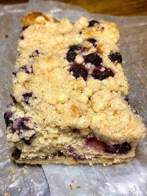 A slice of blueberry coffee cake - all their baked goods are made from scratch