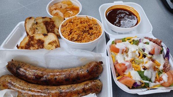 Boudin, jambalaya, salad, cobbler and sauce