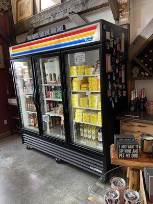 Cooler with chilled wine bottles, local cheeses, beef and elk salami, sodas.