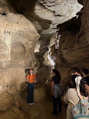 Tour guide explaining how things were formed.