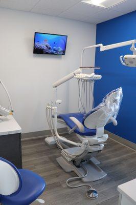 Treatment rooms have TV's for patient entertainment. Dentist Roswell GA - Family Dentist - Sunshine Smiles Dentistry