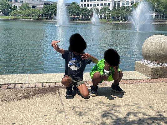 Littles enjoying time in front of the fountain