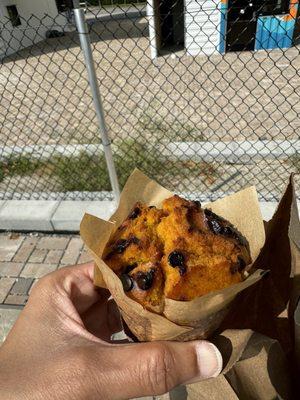 Pumpkin chocolate chip muffin warmed up and delightful