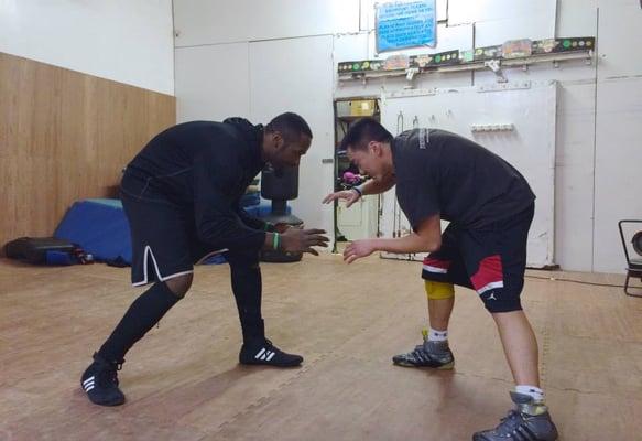 Devon Williams wrestling with client Alick Wong