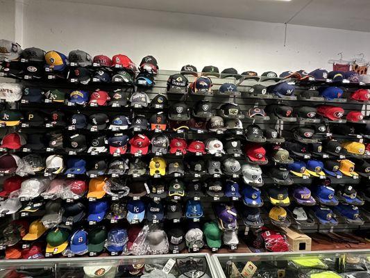 A diverse array of snapbacks, fitted caps, and beanies to choose from.