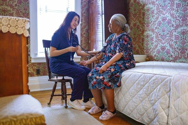 One of our team members checking a patient's blood pressure.