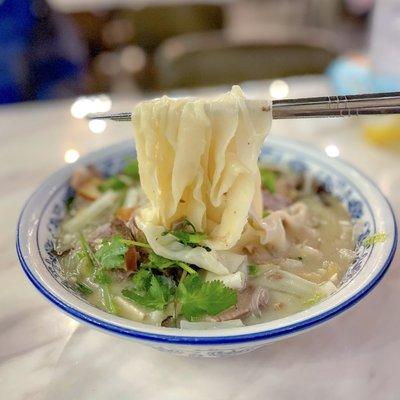 Lamb noodle soup with wide noodles