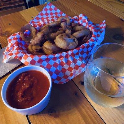 Onion  rings, marinara, and champagne