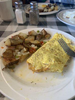 Ham and cheese omelette and "those potatoes"