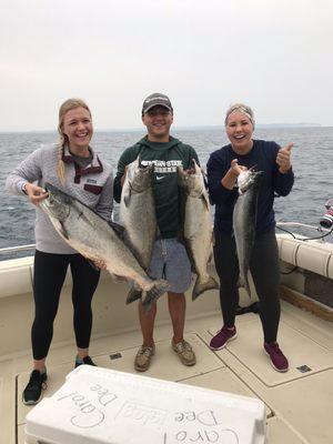 First Mate Mike Osorio holding up some nice King Salmon with some lovely young ladies we had on this summer!