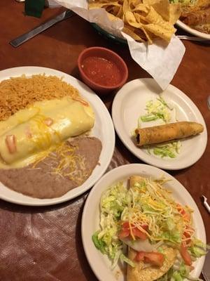 Avocado enchilada with queso sauce, chicken flauta, crispy beef taco.