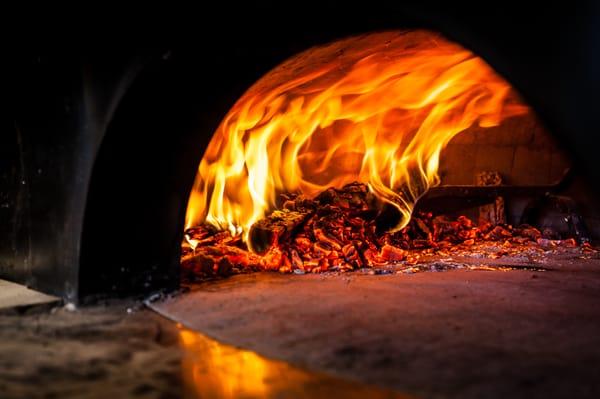 We cook our pizzas in under 90 seconds in a 900 degree wood fired oven.