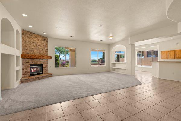 Beautiful open-concept floor plan and impressive fireplace with rock surround.