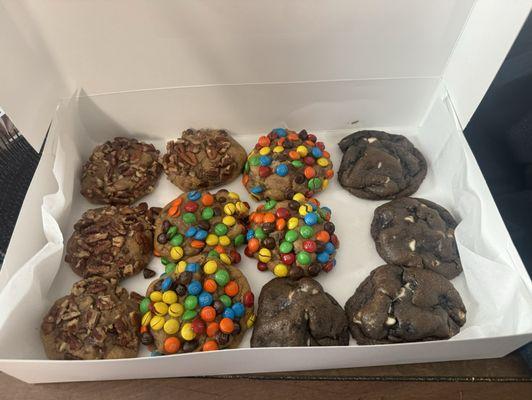 Dozen minis we ordered. Size of regular cookie. Chocolate chip pecan, triple chocolate and m&m. Very generous on ingredients.