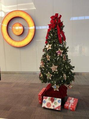 Upcenter tree. Choose a child to purchase items for. The ornaments were decorated by children at the center.