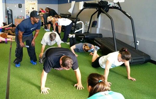 Mac James, owner and trainer, teaching a full-body boot camp.