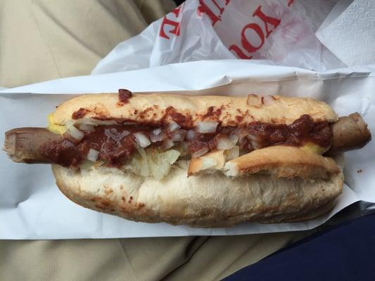 Hot dog with mustard onion and sauce