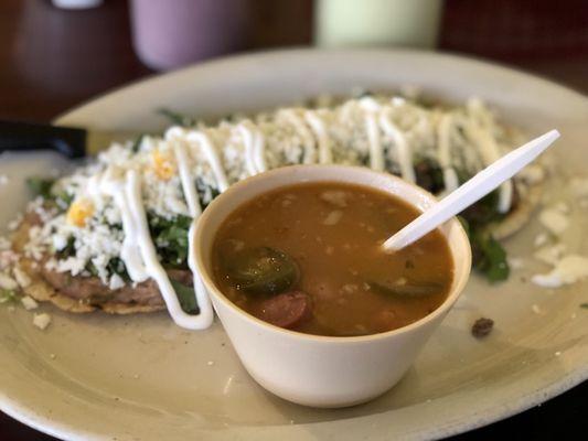 Huarache de asada  hotdog in borracho beans