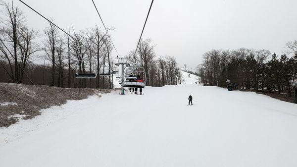 Heading up to the North Peak - decent snow coverage. Only sparse by lifts and the trees.