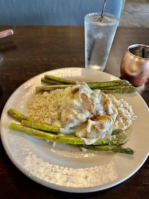 Stuffed Brie and apple chicken served on top of a bed of rice and grilled asparagus