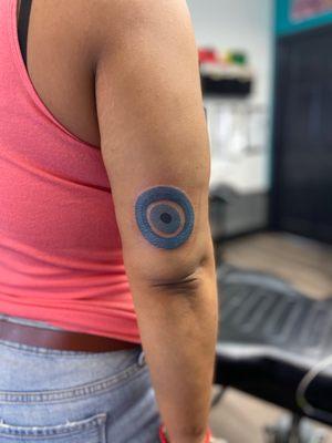 Evil eye tattoo.