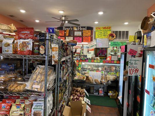 Delightful deli counter in the back with a great selection of sandwiches, meats, and cheeses