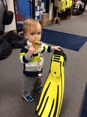 Little man helping mommy pick out some gear.