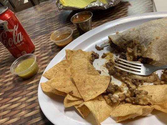 Asada Burrito with chips and different salsas.