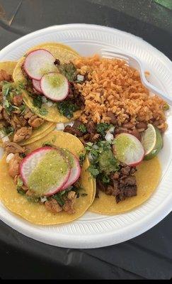 Chicken and asada tacos rice and beans with a delicious green salsa