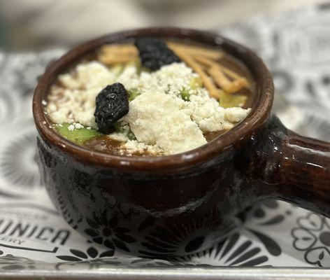 Our famous SOPA TARASCA, a bean-tomato soup with cheese, crispy tortillas, queso fresco, and avocado as toppings