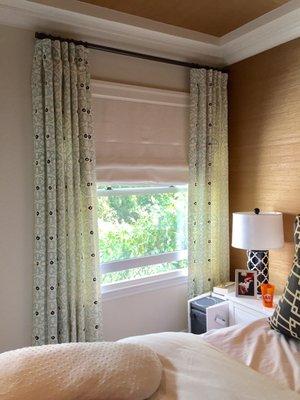 Inverted pleat curtains and flat roman shade.