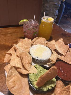 Chips, guac and queso with homemade chips; blackberry and mango margaritas