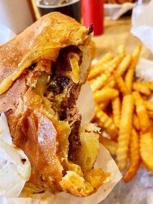 Hamburger with fried onions and mustard with fries