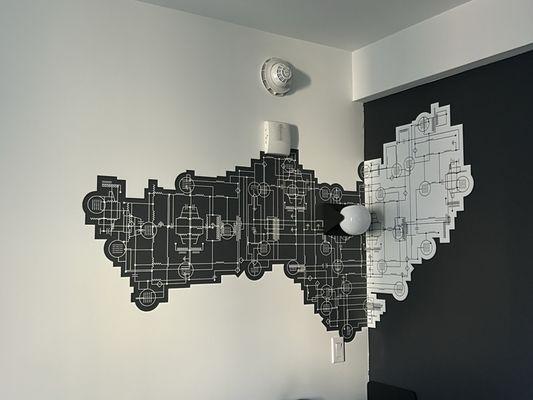 The NYC map etched on each corner of the room.