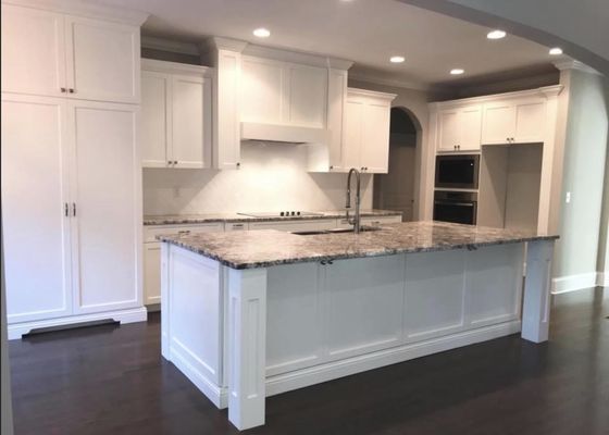 Custom Kitchen with a huge and elegant mantle hood and island