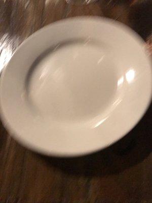 Oops. Blurry plate from which you're expected to eat pizza. Would've been stuck with the tinier bread plate had we not asked.