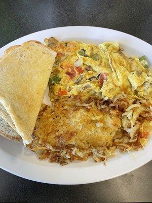 Veggie omelette - comes with hash browns (pictured) or red potatoes, plus a side of toast (sourdough pictured). All delicious!