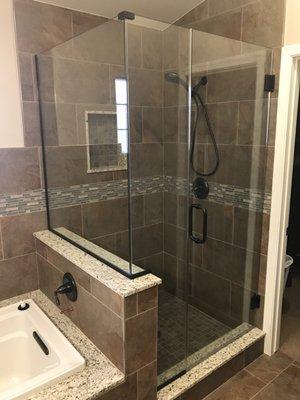 New shower and enclosure.  Mortar dry pack shower, new tile, etc.  An upgraded and beautiful modern bathroom!