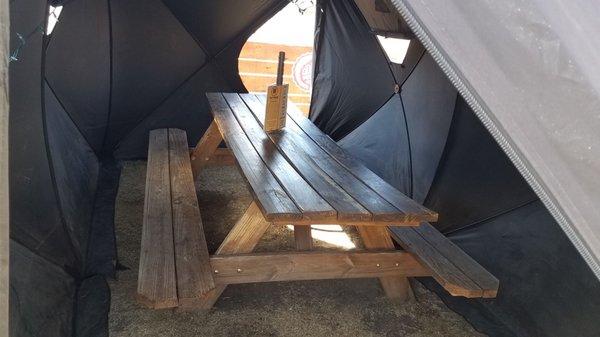 Picnic table in the oversized Covid pod.