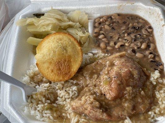 Smothered pork chop in gravy, with black eye peas, and cabbage. Just like grandma makes! Gravy will comfort you, and put you to sleep..