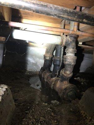 Fix leak and broken pipes underneath the house