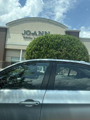 Front of Joannes, right next to two empty stores